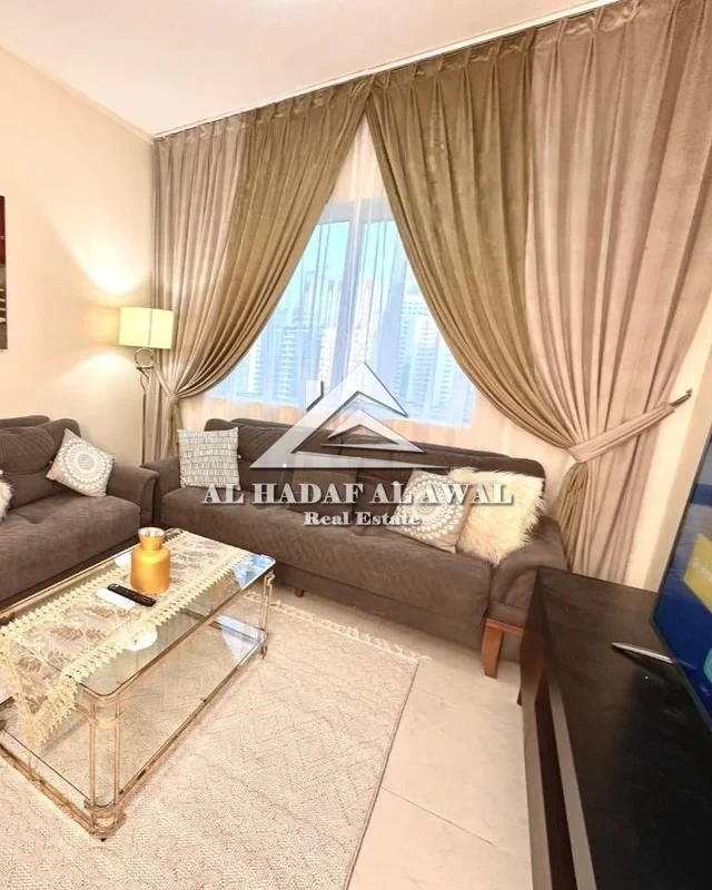 Sharjah Al Taawun, furnished apartment with hotel furniture, second floor, one bedroom, living room, kitchen, and two bathrooms